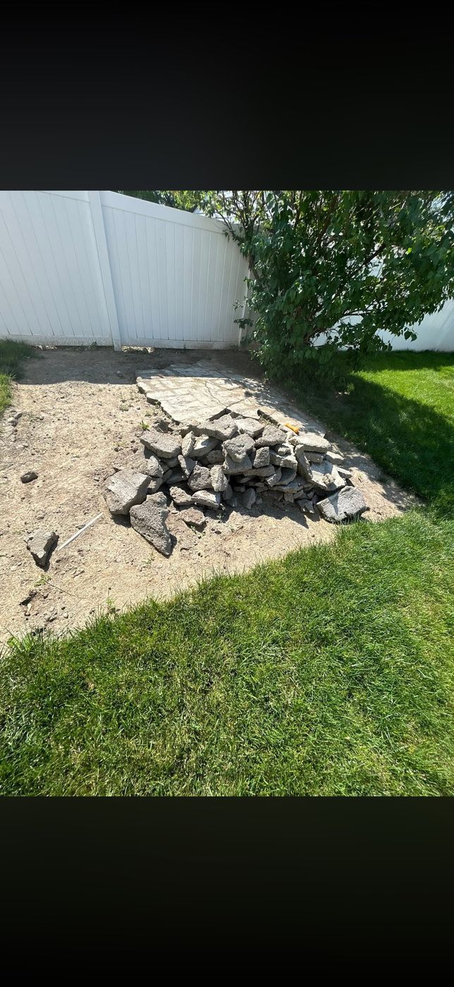Pile of broken concrete in a backyard in Allen Park, MI before haul-away