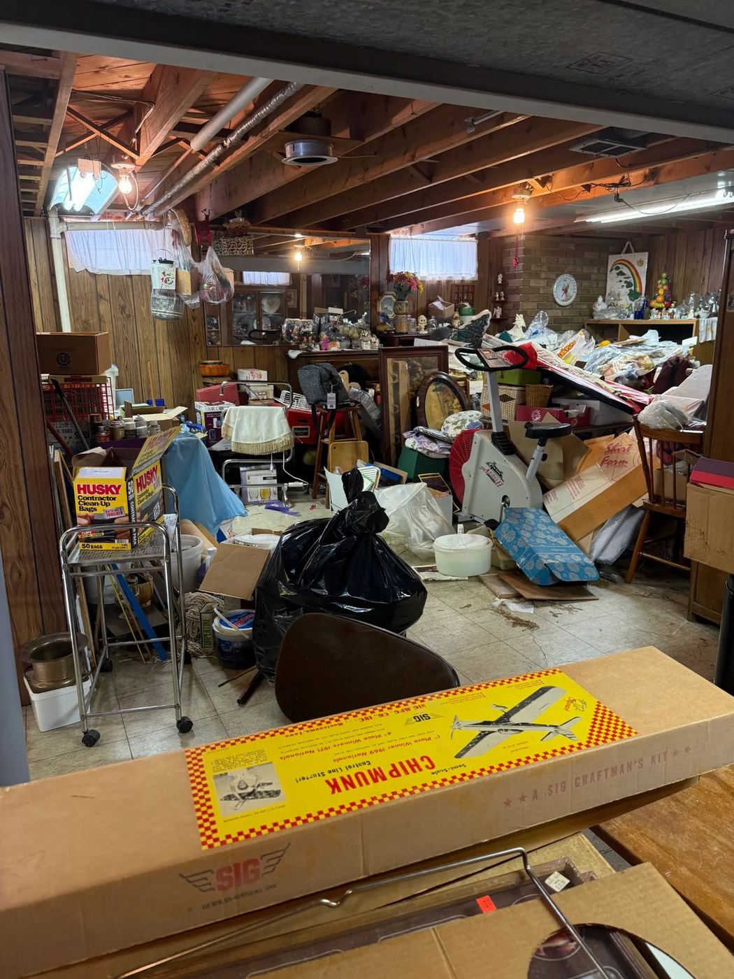 Basement packed with belongings before an estate cleanout in Allen Park, MI