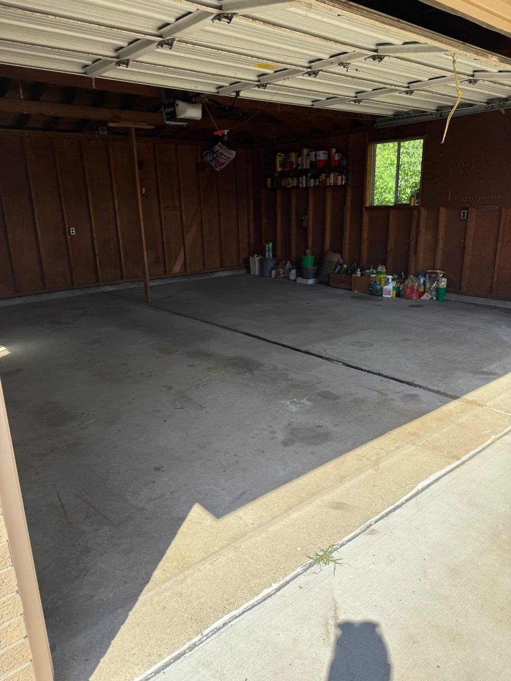 Two-car garage cleared out after an estate cleanout in Allen Park, MI