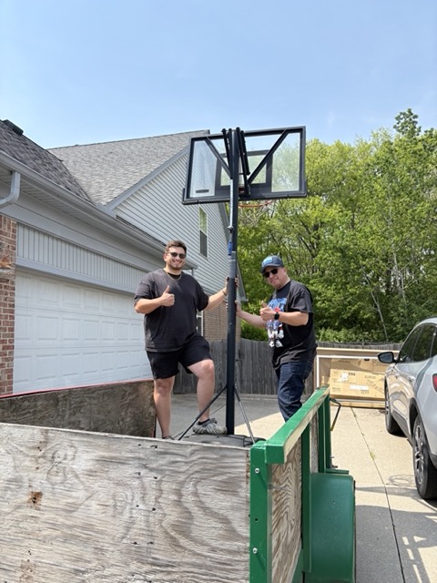 Sanchez Junk & Haul Co. — local owner-operators with their hauling trailer on a junk removal job in Downriver, Metro Detroit